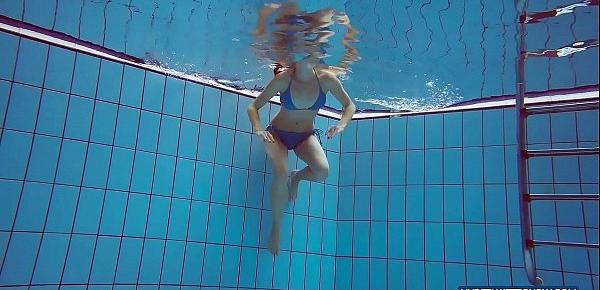 Redhead in blue bikini showing her body